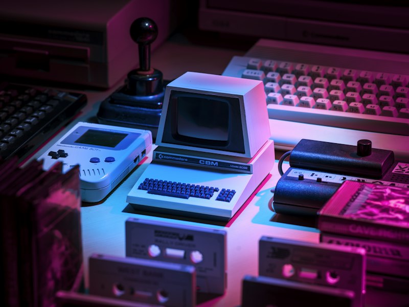 Founder at a desk covered in game boxes and controllers